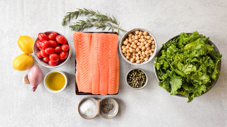 1-pan baked salmon with mustard greens and chickpeas ingredients on countertop