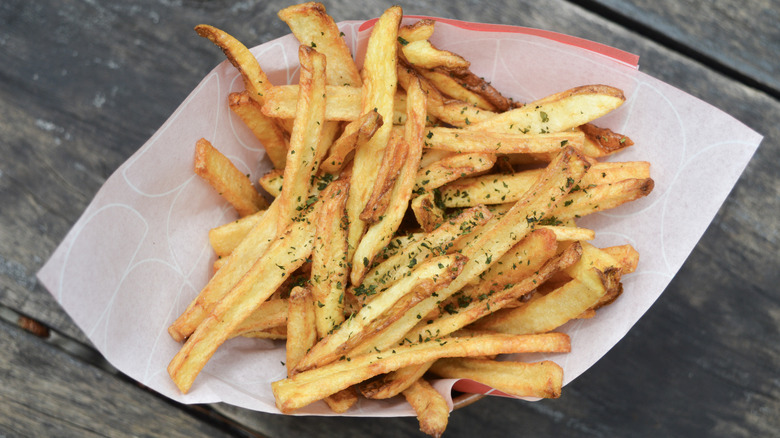 Plate of french fries with parsley