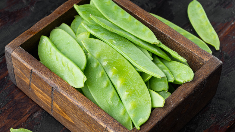 Snap peas in wooden box