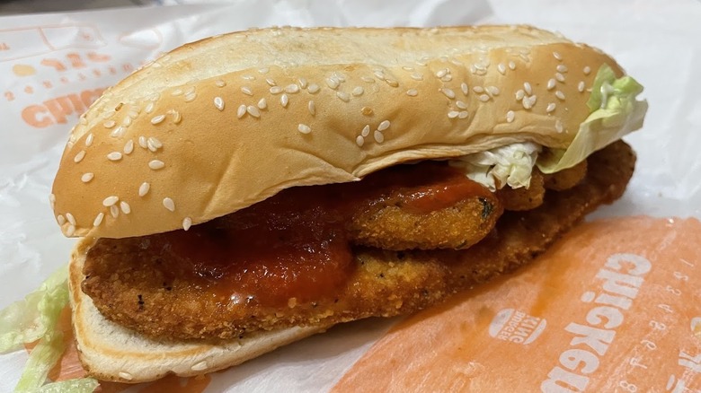 An Original Chicken Sandwich is shown with Mozzarella Fries inside it.