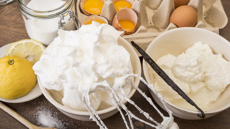 Whipping fresh meringue next to its ingredients