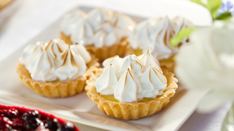 Mini lemon meringue tarts on a plate