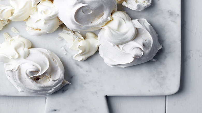 Mini destroyed pavlova shells on a baking tray