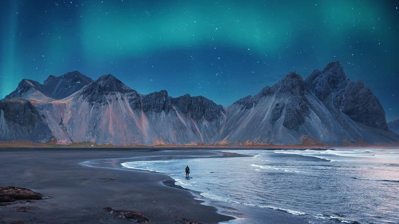 Iceland beach with Northern Lights in sky