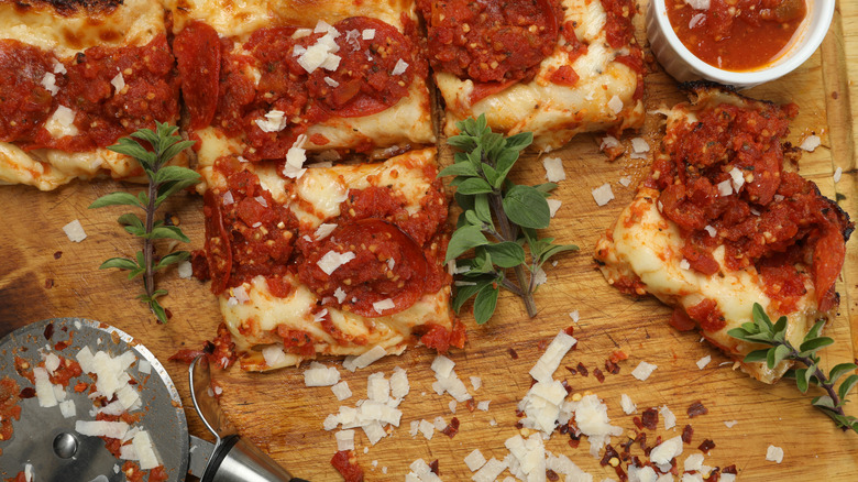 Detroit style pizza with cheese and garnishes