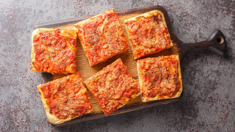 Sicilian pizza squares arranged on a board