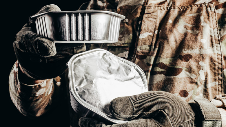 A soldier with meals ready to eat