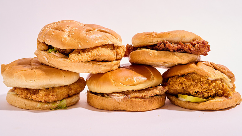 Chicken sandwiches stacked on table