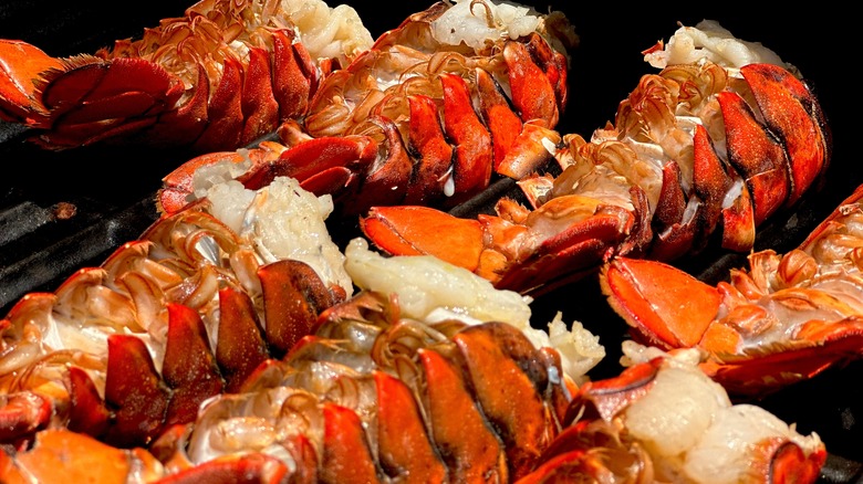 lobster tails being grilled