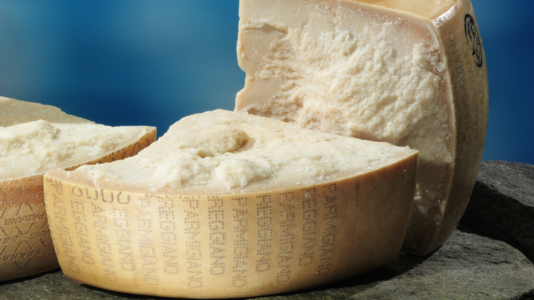 Cut wheel of parmesan cheese