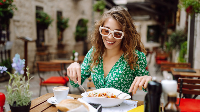 Woman dines at a restaurant.