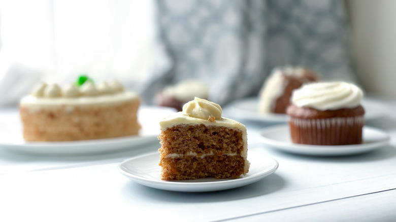 An array of carrot cakes against a sunny window