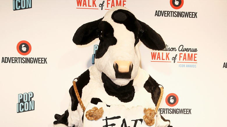 Chick-fil-A cow poses on the Advertising Week red carpet.