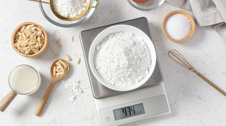 weighing flour on scale