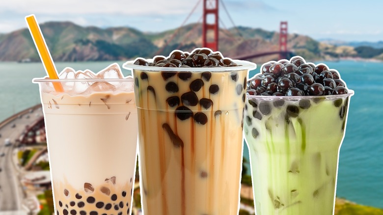 Three bubble tea cups in front of landscape of San Francisco's Golden Gate Bridge