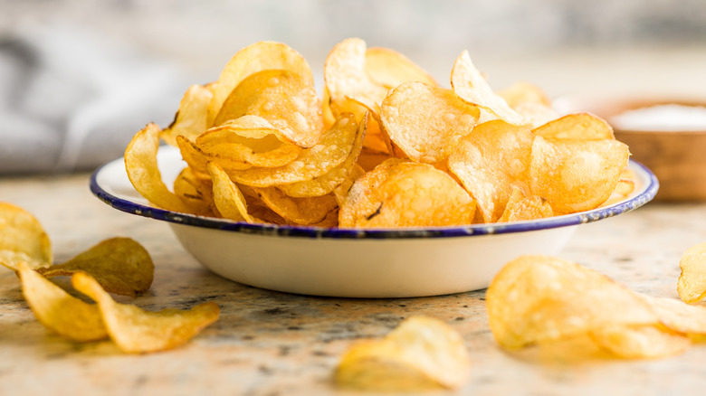 Potato chips in a white bowl