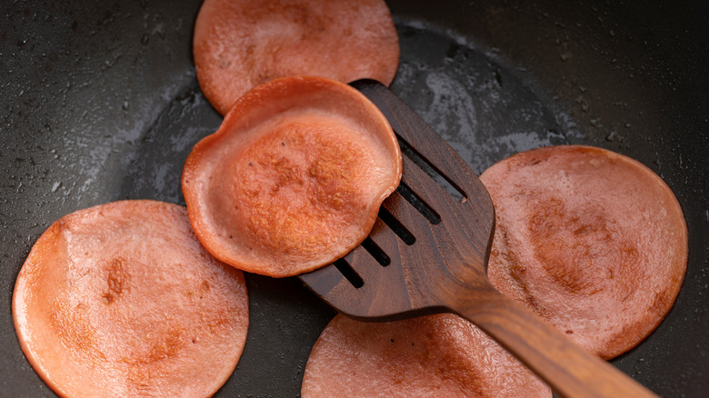 Sliced bologna in a frying pan