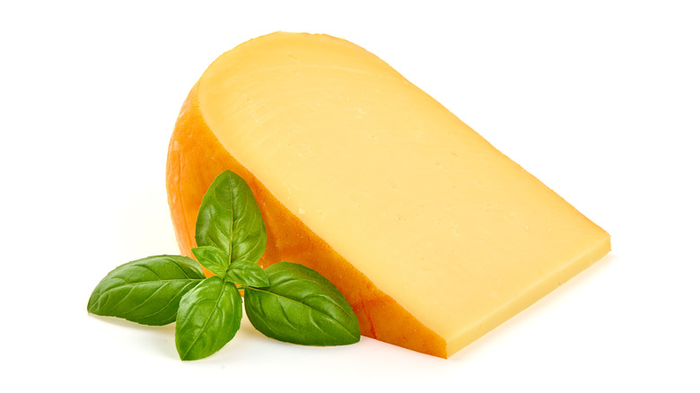 A wedge of Gouda cheese