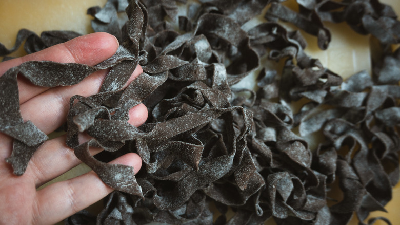 Cocoa pasta on a floured work surface