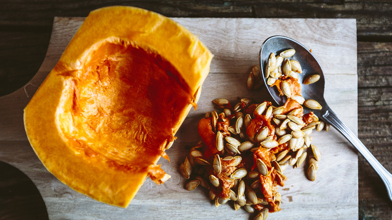 halved pumpkin with seeds