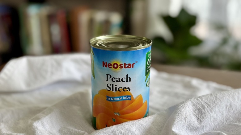 NeoStar Peach Slices on table in front of shelf