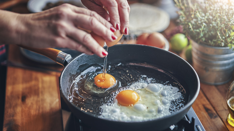 Two eggs frying in a pan