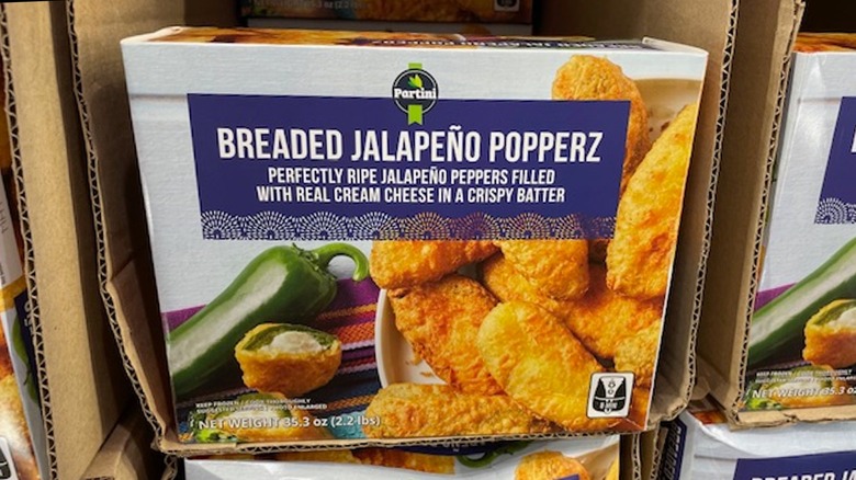 A box of breaded jalapeño poppers in the display box on the shelf at Costco