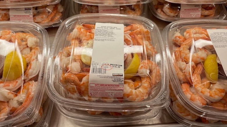 A tray of Costco shrimp cocktail with the price tag on top