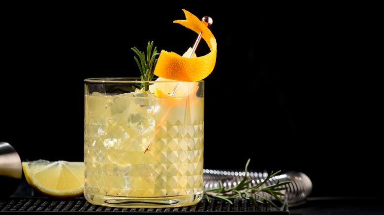 Cocktail with orange twist garnish