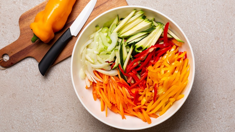 Julienne vegetables in white bowl