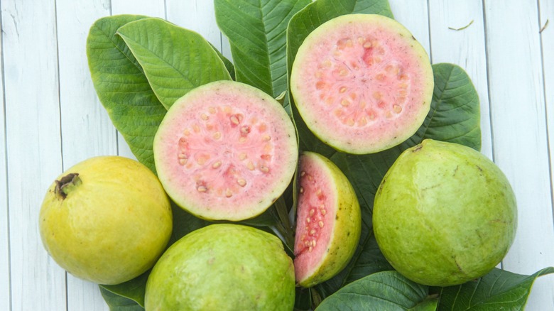 Cut and whole fresh guavas