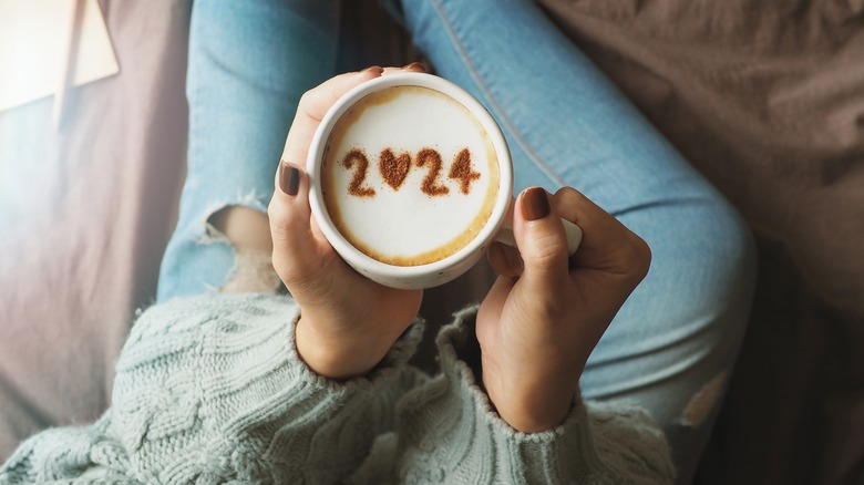 Coffee cup with 2024 written in foam