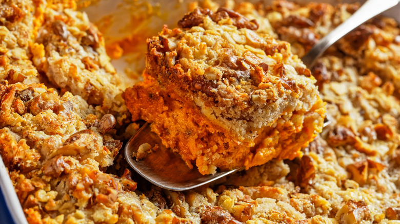 pumpkin dump cake with a slice taken out