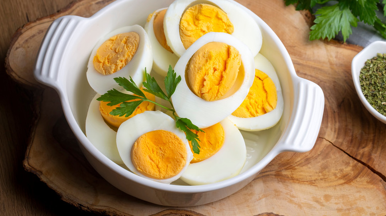 White ramekin of hard-boiled egg slices