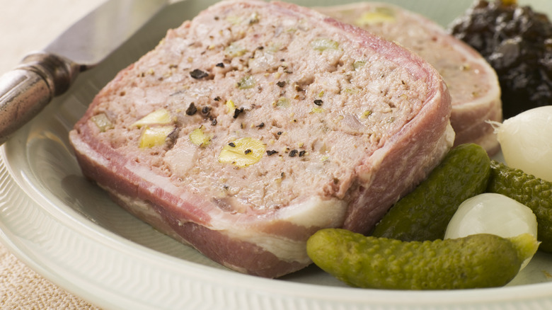 Slices of pate with cornichons and relish