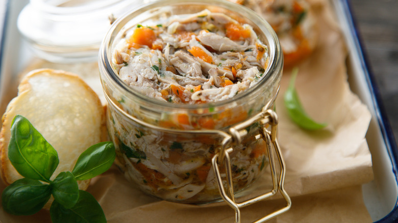 Jar of rillettes and bread slices