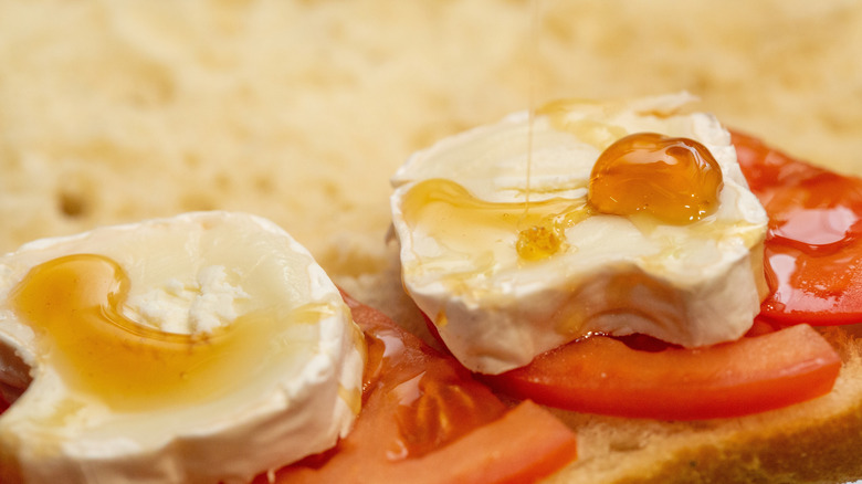 Tomatoes and goat cheese on a sandwich