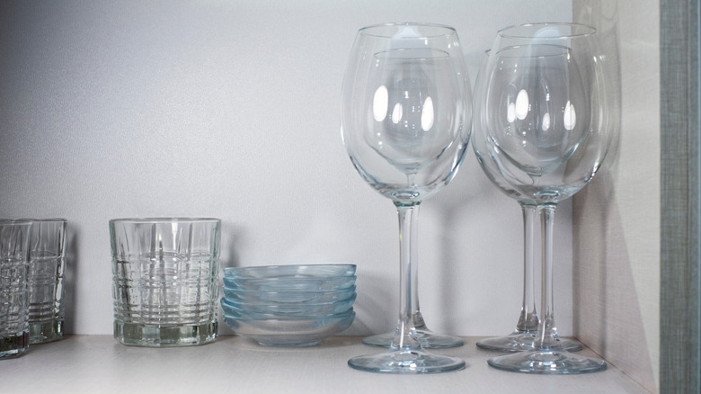 Sparkling clean glassware in cupboard