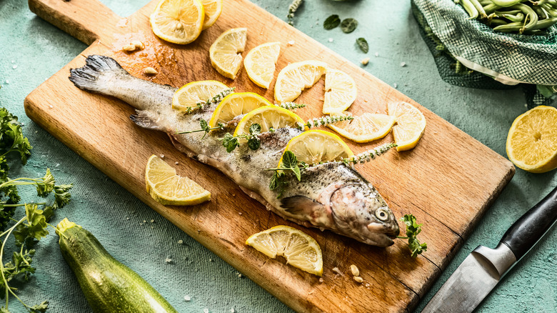 whole fish covered in lemon slices