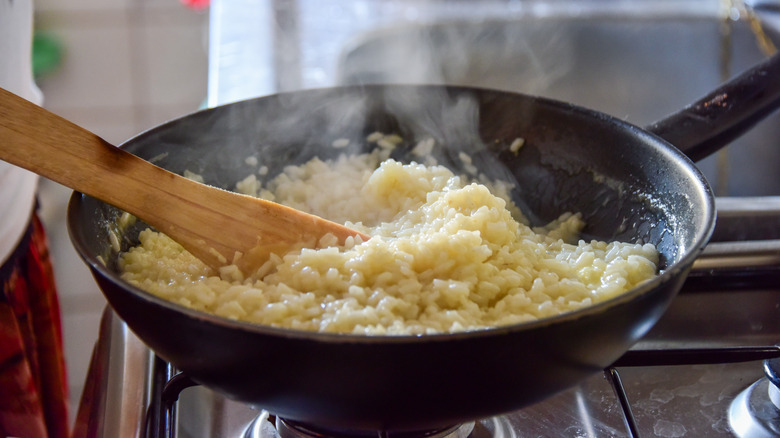 cooking creamy risotto in a pan