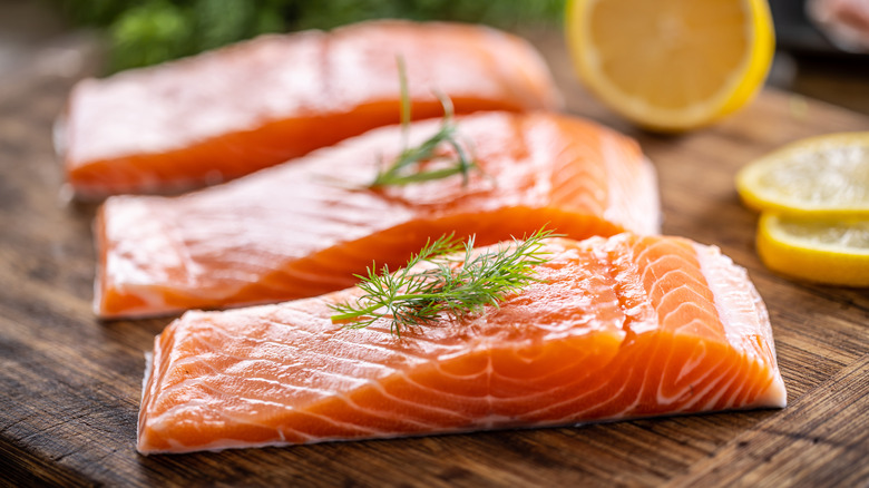 three filets of raw salmon