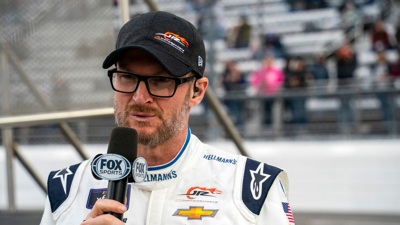 Dale Earnhardt Jr. speaking into a microphone at a race