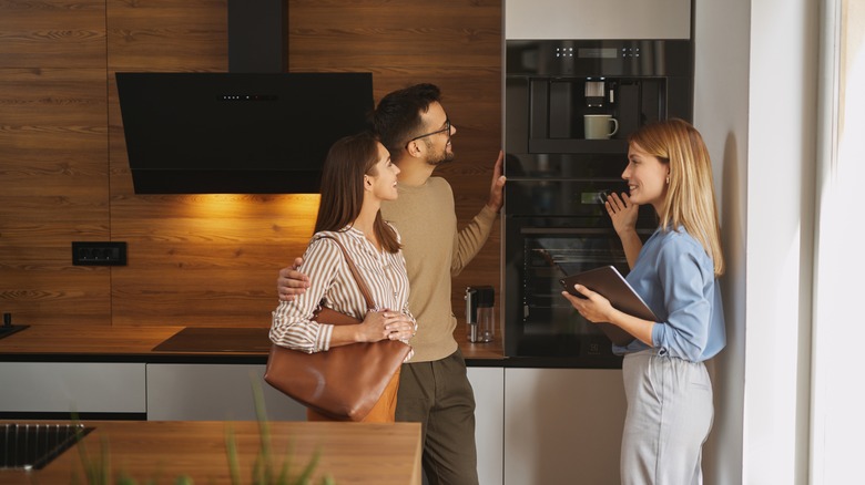Two people shopping for a new oven