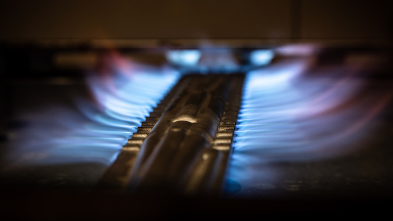 Flames inside a gas oven range