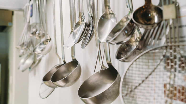 Kitchen ladles and utenstils hanging 