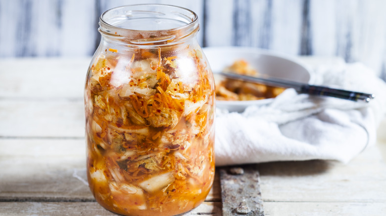 Open jar of kimchi