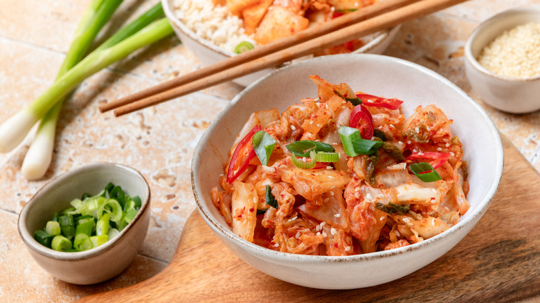 Bowl of kimchi with chopsticks