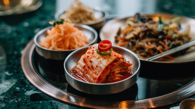 Assorted kimchi varieties in small bowls