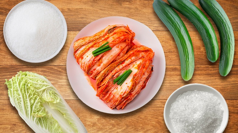 Kimchi surrounded by its ingredients