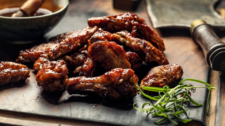 baked chicken wings on cutting board